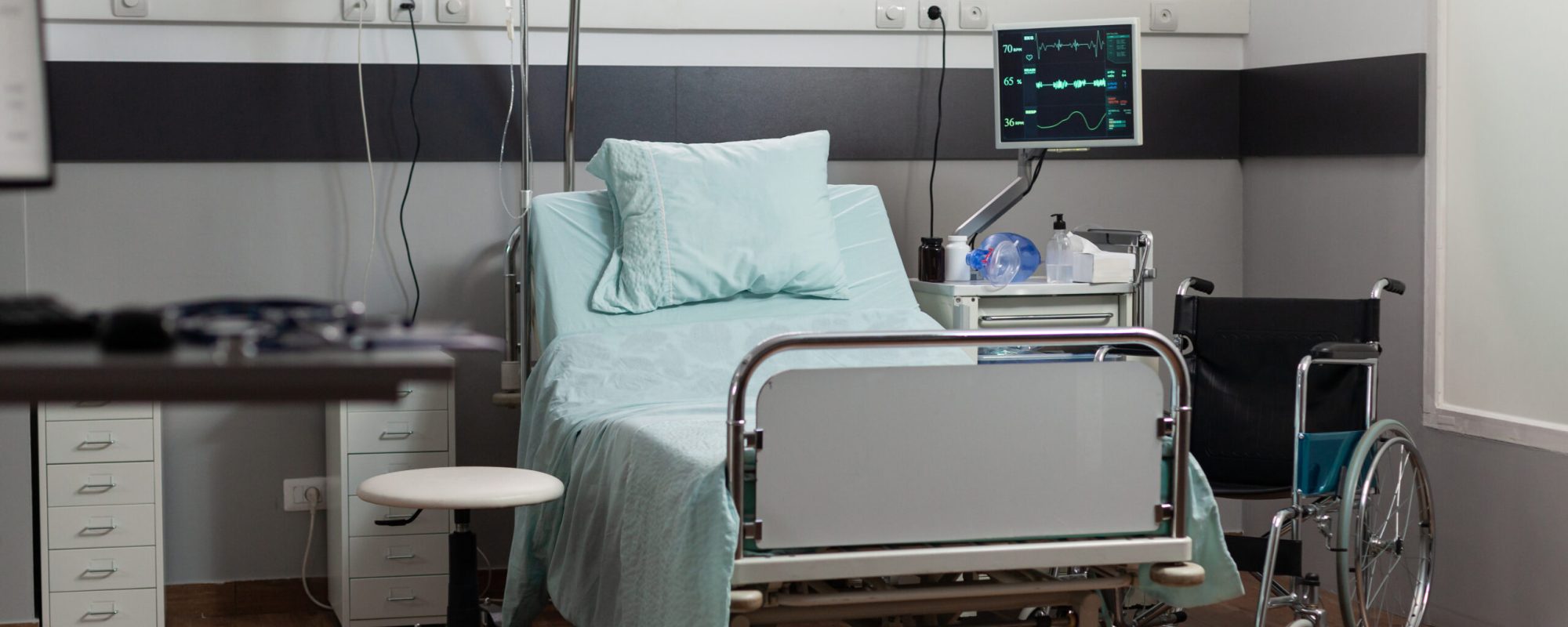 Empty hospital room with nobody in it having a single bed comfortable bed, modern equipment. Recovery room of hospital ward, sterile floor. Ambulatory room after surgery.